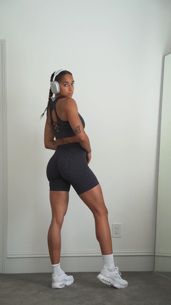 activewear set, biker shorts, sports bra, workout set, compression shorts, brand awareness, lifestyle, energetic, trustworthy, neutral, black